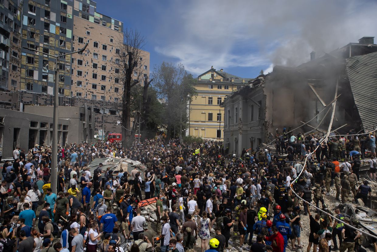 People clear rubble from a building at one of the largest children’s hospitals of Ukraine, ‘Okhmatdyt’, partially destroyed by a Russian missile strike on July 8, 2024 in Kyiv, Ukraine.